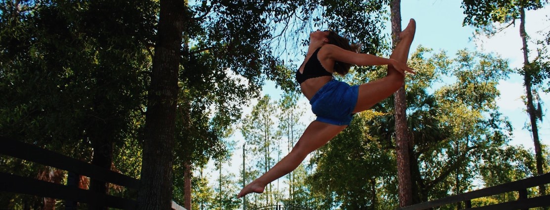 student jumping on air gracefully
